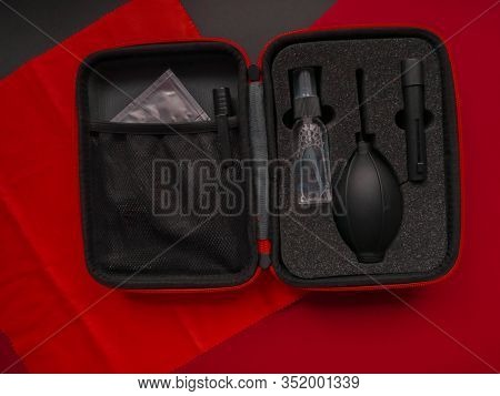Camera And Lens Care. Camera Cleaning Kits And Camera Gears On Colored Background
