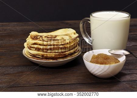 Pancakes With Honey On A Wooden Table. Glass Of Milk. Healthy Food. Breakfast.