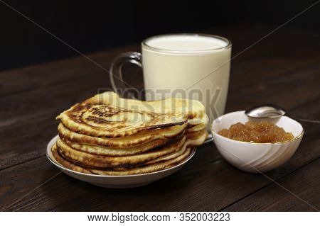 Pancakes With Honey On A Wooden Table. Glass Of Milk. Healthy Food. Breakfast.