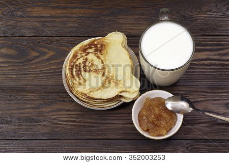 Pancakes With Honey On A Wooden Table. Glass Of Milk. Healthy Food. Breakfast.