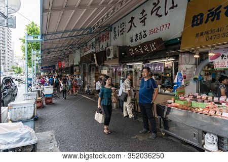 Tokyo, Japan - August 30, 2016: People At Tsukuji Fish Market In Chuo District In Tokyo, Japan. Text