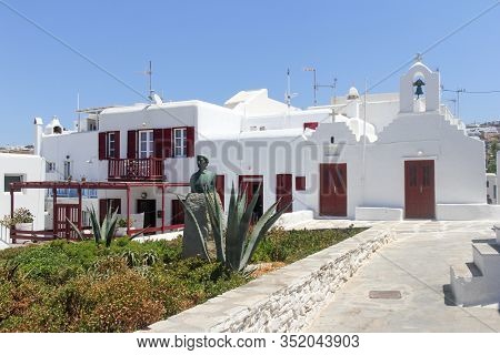 Mykonos, Greece - July 23rd 2016: Church And Statue Of Manto Mavrogenous In Chora. The Island Is A P
