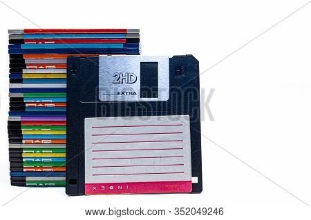 Numerous Black Floppydisks Lined Up On A White Background