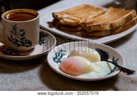 Half Boiled Organic Eggs, Toast Bread And Coffee, Popular Nutritious Chinese Style Breakfast In Mala
