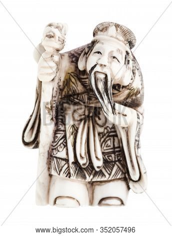 Antique Japanese Netsuke - Wise Man With Staff Carved From Ivory Isolated On White Background