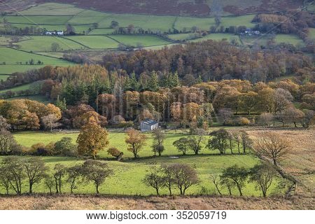 Stunning Autumn Fall Landscape View Along Valley Towards Mellbreak And Grasmoor In Lake District Wit