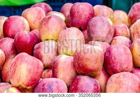 A Bunch Of Whole Ripe Apple In Fruit Market