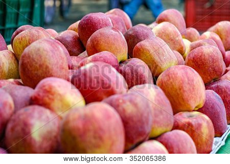 A Bunch Of Whole Ripe Apple In Fruit Market