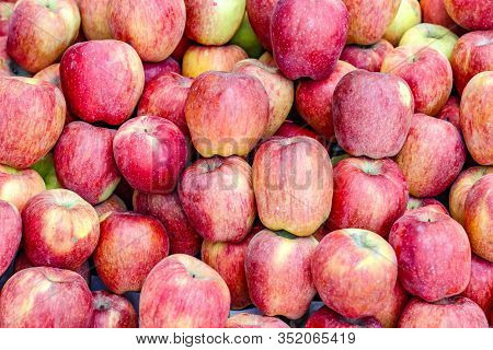 A Bunch Of Whole Ripe Apple In Fruit Market