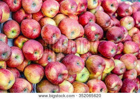 A Bunch Of Whole Ripe Apple In Fruit Market