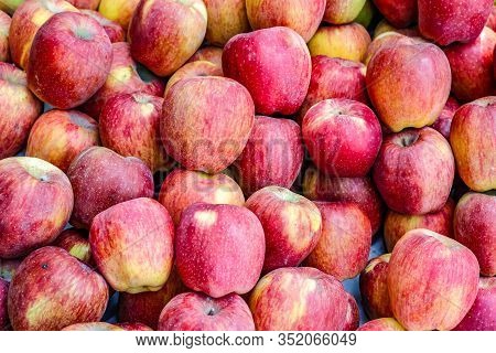A Bunch Of Whole Ripe Apple In Fruit Market