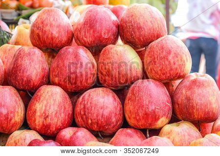 A Bunch Of Whole Ripe Apple In Fruit Market