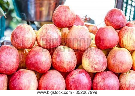 A Bunch Of Whole Ripe Apple In Fruit Market