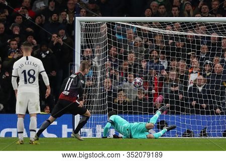 LONDON, ENGLAND. 19 FEBRUARY 2020. Forward Timo Werner Of Leipzig scores from a penalty against Goalkeeper Hugo Lloris of Tottenham during the UEFA Champions League