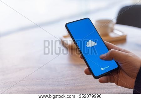 Chiang Mai, Thailand - Jan.18,2020: Man Holding Xiaomi Mi Mix 3 With Onedrive On Screen. Microsoft O