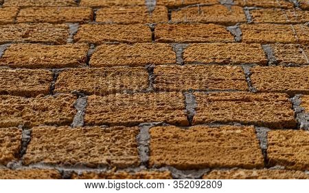 Red brick wall background close-up house on