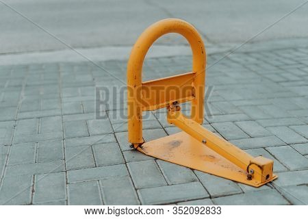 Yellow Limiter For Car Parking Raised On Street