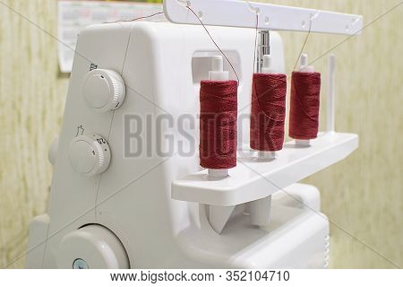 Sewing Machine For Wrapping Sections Of Textile Materials