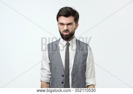 Angry Irritated Young Man Looking Camera Being Displeased With News.