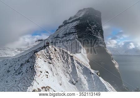 Kallur Lighthouse On Kalsoy Island With Borgarin Mountain Behind, Faroe Islands