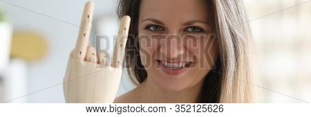 Portrait Of Happy Cheerful Female With Artificial Limb Showing Cool Sign. Joyful Blonde Looking At C