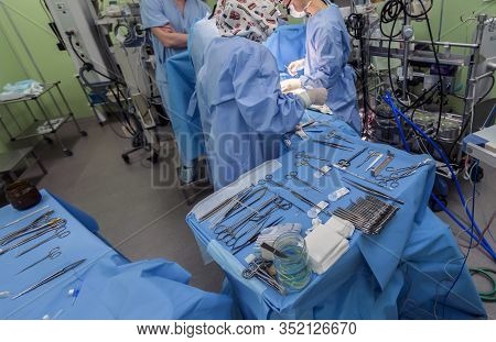 Surgical Instruments In Operating Room On Table.