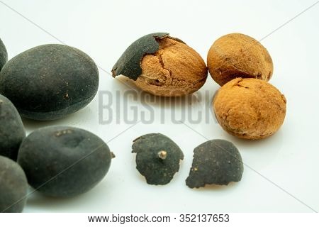 Dried Black Dialium With Shell And Half Open Isolated On White Background.