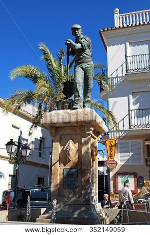 Monda, Spain - October 29, 2008 - Statue And Fountain In The Plaza De La Ermita, Monda, Malaga Provi