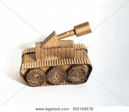 Toy Tank Made By Children From Corrugated Cardboard Are Fighting. Toy Cardboard Tank Isolated On A W