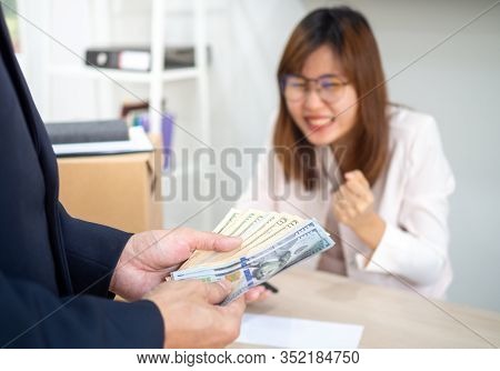 Management Is Counting Bonus Money For Company Employees. The Staff Feel Happy, Beaming.