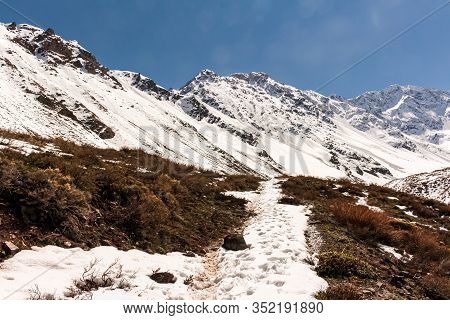 Natural Monument El Morado, Central Andes Of Chile. A Snowy Rocky Mountain