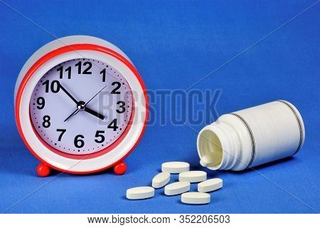 Medicine In Tablets And A Clock For Time Control. Individual Treatment Plan Is Drawn Up Based On Con