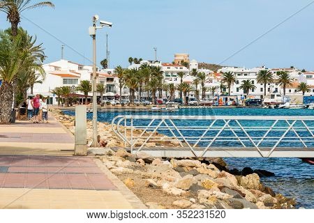 Menorca, Spain - October 12, 2019: The Seafront Promenade And Port In Fornells, Menorca, Spain
