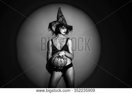 Sexy Girl With Pumpkin On Halloween Background. Wonam Murderers Hold Pumpkin. Fashion Nude Art Desig