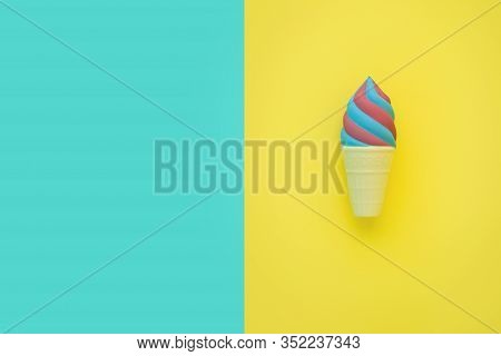 Flat Lay Antistress Toy Squish Ice Cream Red Blue In Waffle Cone.bright Blue Yellow Background.compr