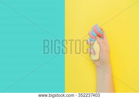Flat Lay Antistress Toy Squish Ice Cream In Waffle Cone Squezzed In Hand.bright Blue Yellow Backgrou