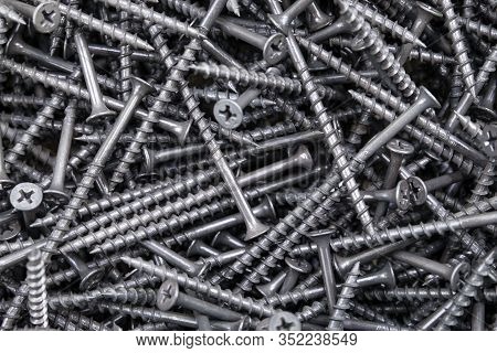 The Background Of A Lot Of Large Self-cutters For Repair And Construction Work. Horizontal Orientati