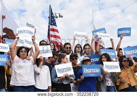 SANTA ANA, CALIFORNIA - 21 FEB 2020: Bernie Sanders Rally. Group of Supporters holding their Bernie Signs at an outdoor rally. 