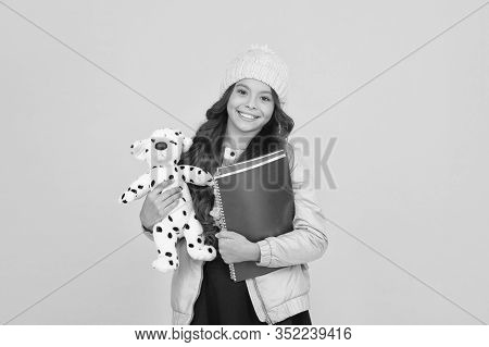 Classes Begin. Happy Small Girl Hold Toy Dog. Winter Holiday And Vacation. Childhood Happiness. Chil