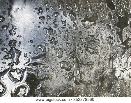 Water Drops From The Rain On The Gray Surface Of The Table