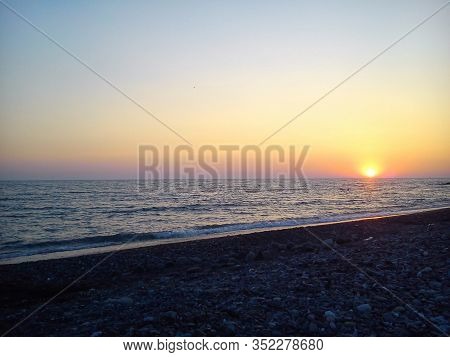 Sunset On The Sea. The Sun Goes Below The Horizon.