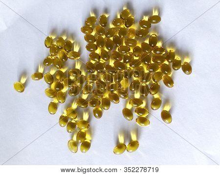 Many Yellow D3 Tablets Isolated On A White Background.