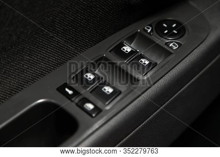 Novosibirsk, Russia - January 24, 2020:  Lada Priora, Close-up Of The Side Door Buttons: Window Adju