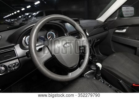 Novosibirsk, Russia - January 24, 2020:  Lada Priora, Dashboard, Player, Steering Wheel With Logo An