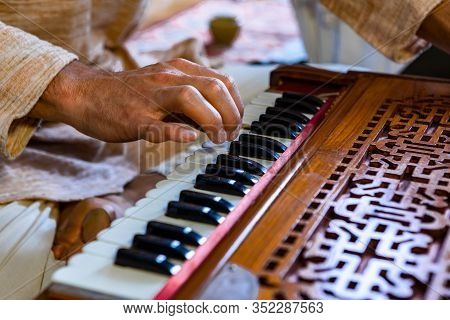 Closeup Of Shamanic Hands Pressing Harmonium Keys Playing Sacred Kirtan Music For Divine Power And S