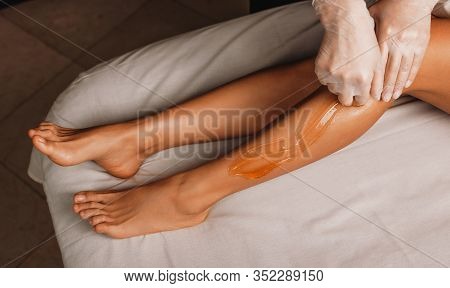 Sugaring Procedure Done By A Professional Dermatologist In A Spa Salon