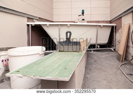 Bathroom Interior, Putty Knife, Dirty Bucket, Ceramic Tiles