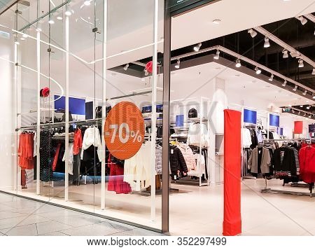 Entrance To The Clothing Store In The Mall.  Huge Discount Banners In Store For Total Sale Before Ne