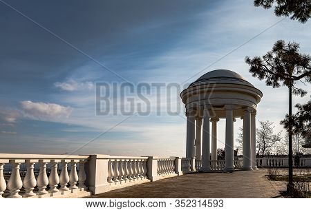 Rotunda On The Central Embankment Of The City Of Volgograd Against A Blue Sky