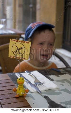A Crying Child Allergic To Gluten In A Cafe